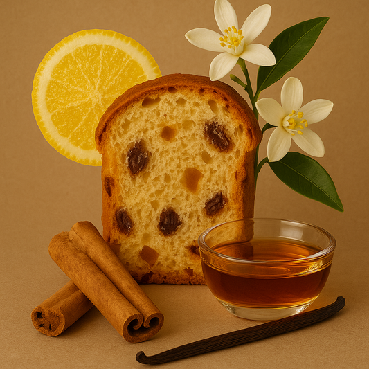 Loaf of raisin bread with a slice, lemon, cinnamon sticks, vanilla bean, and a small bowl of honey on a brown background.